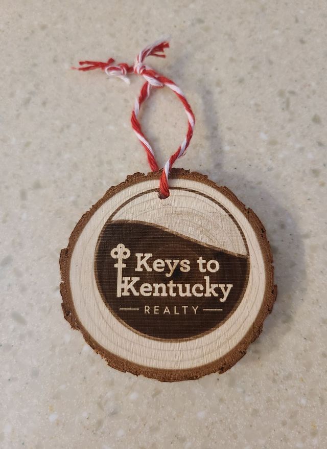 Wood slice ornament with a business logo