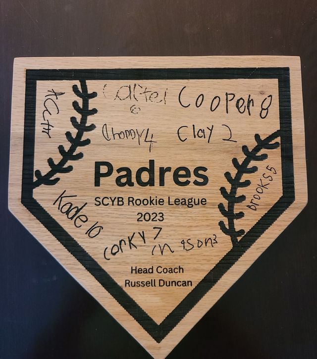 Youth baseball team home plate with signatures