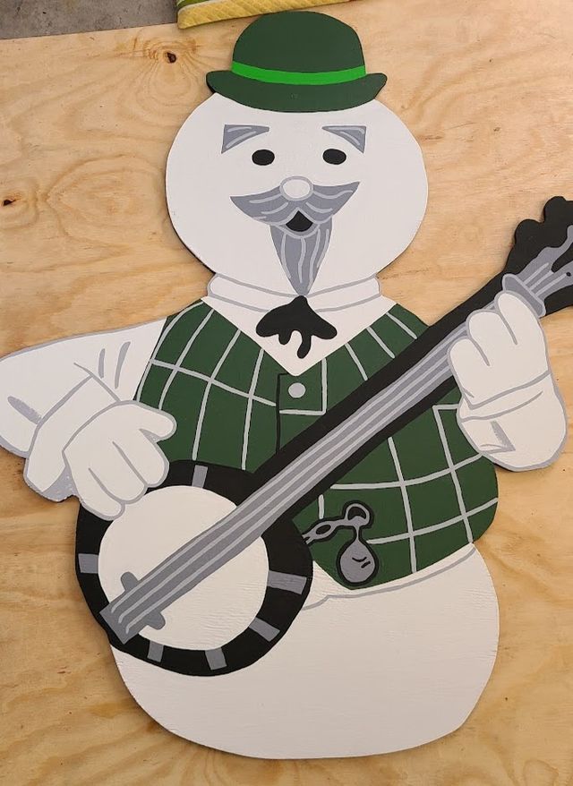 Sam the Snowman with his banjo