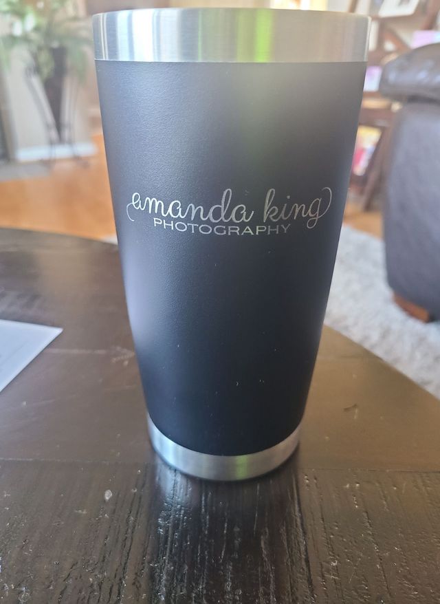 Tumbler with a photography business logo