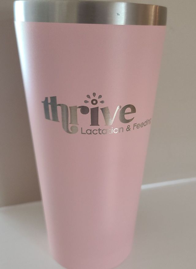 Pink tumbler with a business logo