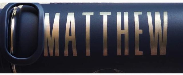 Name engraved on a navy tumbler